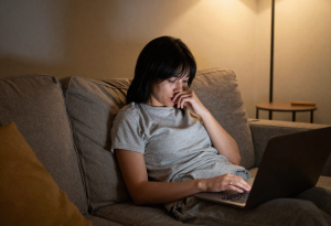 why you feel heavier at night - Person sitting and relaxing in the evening after a long day