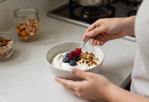 Person preparing a balanced snack with protein, fiber, and healthy fats