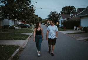 Person walking gently after a big meal to help digestion and reduce bloating.