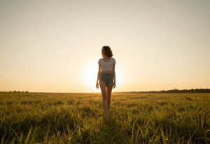 Person walking barefoot outdoors to reduce stress and improve sleep with grounding