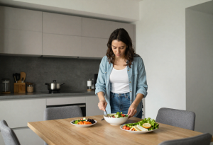 walking after meals - person finishing a meal before a post-meal walk to boost metabolism