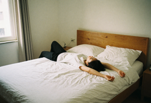 Person waking up after restful sleep to support appetite control