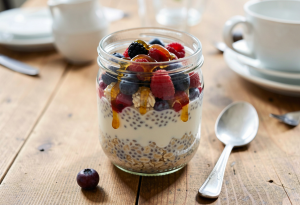 Healthy breakfast ideas - Glass jar of overnight oats with chia seeds, almond milk, and fresh berries, ready to eat for a nutritious whole foods breakfast