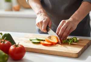 Person preparing a healthy meal to support kidney function and overall wellness.