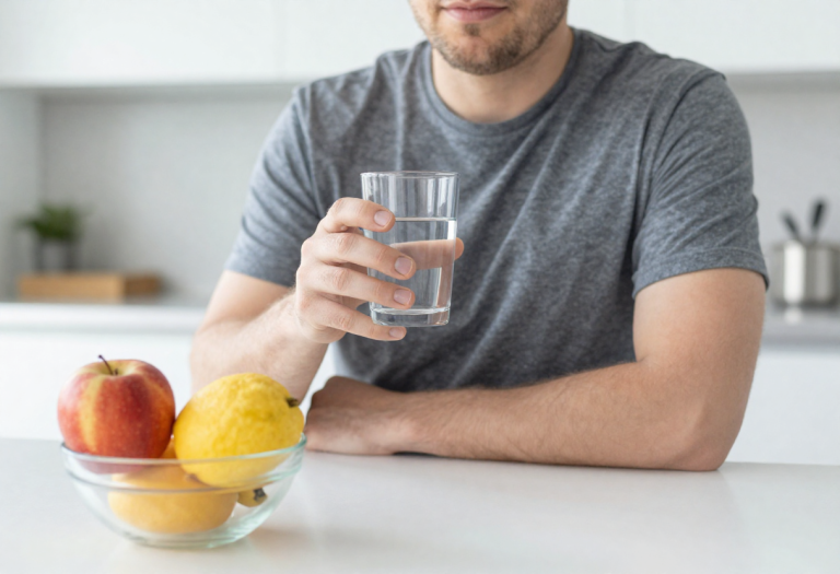 Person drinking water and practicing healthy habits to support kidney function.
