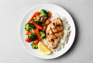 clean eating - Balanced plate with whole, nutrient-dense foods demonstrating clean eating principles.