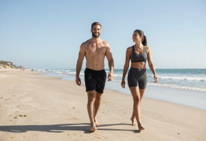 Fit and healthy woman walking on a beach, representing the benefits of clean eating.